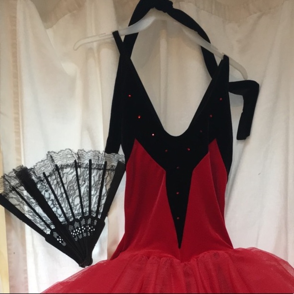 Red and black velvet costume with fan
